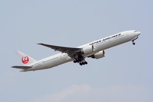 File - A Japan Airlines Boeing 777 in flight near Narita Airport, Japan.