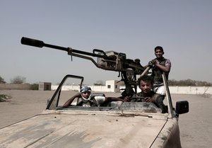 In this Feb. 12, 2018 photo, young Saudi-led backed forces, part of Ahmed Al-Kawkabani's southern resistance unit in Hodeida, petrol al-Khoukha, Yemen.