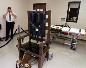 In this Oct. 13, 1999, file photo, Ricky Bell, the warden at Riverbend Maximum Security Institution in Nashville, Tenn., gives a tour of the prison's execution chamber.