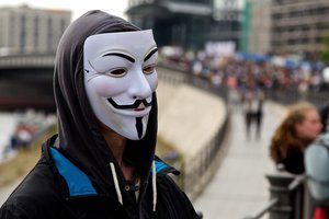 Demonstrators and protesters wearing masks of Guy Fawkes, London