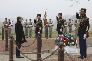 French President Emmanuel Macron lays a wreath during a ceremony as part of the celebrations of the centenary of the First World War, in Morhange, eastern France, Monday, Nov. 5, 2018.