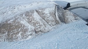 File - An east Greenland glacier seen from the NASA P-3 in April 2014. Greenland’s ice sheet is the second largest mass of ice on Earth, containing enough water to raise ocean levels by about 20 feet.