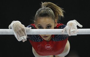 In this Oct. 17, 2010, file photo, Mattie Larson of the U.S. performs on the uneven bars during the women's qualifying session for the World Gymnastics Championships in Rotterdam, Netherlands. Larson, who was molested by Larry Nassar, was among the nearly 250 who gave victim impact statements during his sentencing.