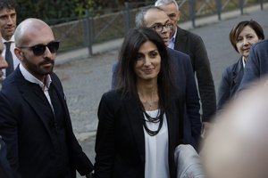 Rome mayor Virginia Raggi talks to journalists as she leave a court, in Rome, Saturday, Nov. 10, 2018