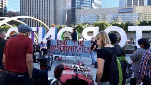 HSF Justice rally in Nathan Phillips Square. Banner reads: "End the Discrimination #HSFJustice"