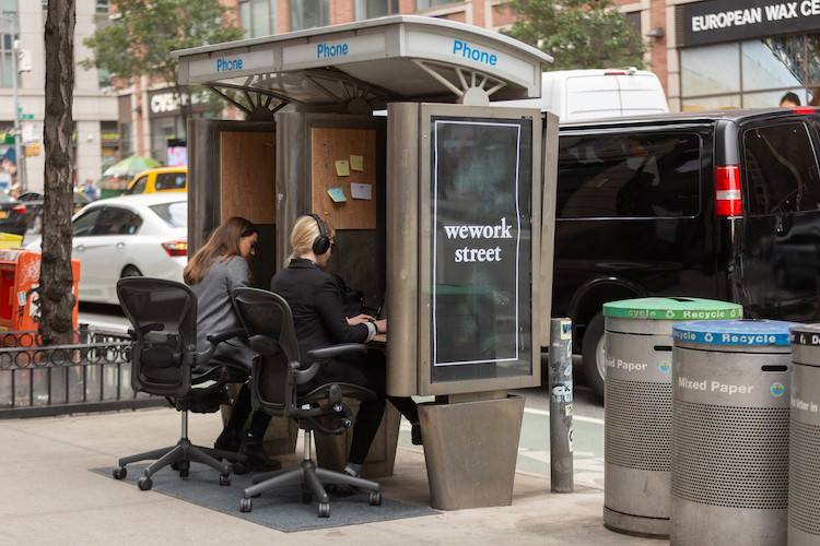 Improv Everywhere Transforms a Pair of Unused NYC Pay Phone Booths Into Outdoor Co-Working Spaces