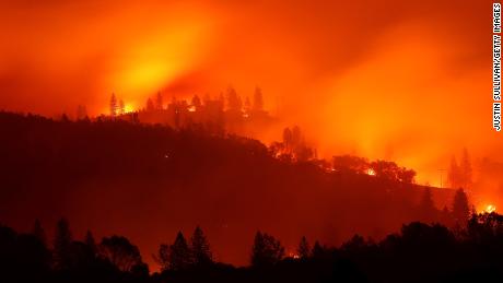 BIG BEND, CA - NOVEMBER 10:  The Camp Fire burns in the hills on November 10, 2018 near Big Bend, California. Fueled by high winds and low humidity the Camp Fire ripped through the town of Paradise charring 105,000 acres, killed 23 people and has destroyed over 6,700 homes and businesses. The fire is currently at 20 percent containment.  (Photo by Justin Sullivan/Getty Images)