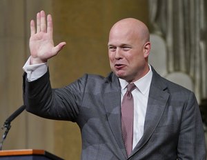 Acting Attorney General Matthew G. Whitaker gestures after speaking at the Dept. of Justice's Annual Veterans Appreciation Day Ceremony, Thursday, Nov. 15, 2018, at the Justice Department in Washington. (AP Photo/Pablo Martinez Monsivais)