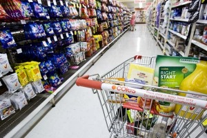 Coles has banned trolleys in some of its self-service checkouts.  