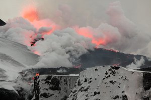 File - Overview of the 2nd fissure on Fimmvörðuháls, close to Iceland's Eyjafjallajökull volcano, as the lava flows down towards the north, turning snow into steam. A previous Icelandic eruption in AD 536 may have caused volcanic ash to pollute the Northern Hemisphere.