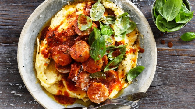 Sausages in sugo with creamy polenta.