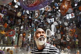 Nick Cave with his huge installation, Kinetic Spinner Forest.