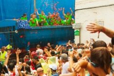 Beginning of La Tomatina festival - tomatoes madness in August 28, 2013 in Bunol, Spain. Battle of tomatoes at street of ...
