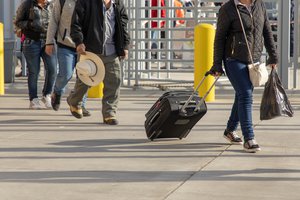 Migrants seeking asylum are assisted by CBP Officers at the San Ysidro Port of Entry prior to the adjudication of their cases