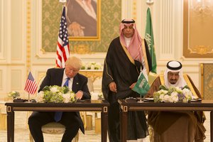 File - President Donald Trump and King Salman bin Abdulaziz Al Saud of Saudi Arabia sign a Joint Strategic Vision Statement for the United States and the Kingdom of Saudi Arabia, during ceremonies, Saturday, May 20, 2017, at the Royal Court Palace in Riyadh, Saudi Arabia.