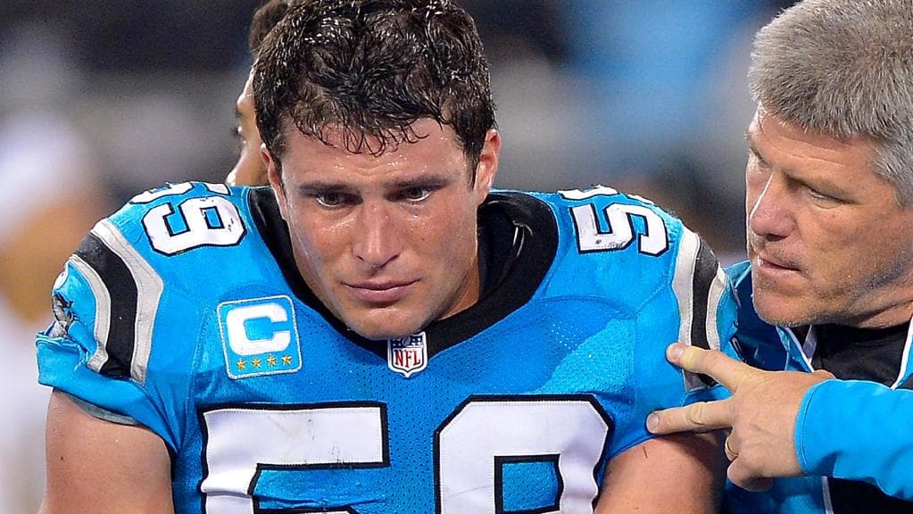 Luke Kuechly #59 of the Carolina Panthers is carried off the field.