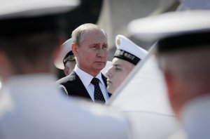 Russian President Vladimir Putin attends the military parade during the Navy Day celebration in St.Petersburg, Russia, Sunday, July 29, 2018.