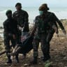 A corpse is retrieved from the beach at Tanjung Lesung beach resort.