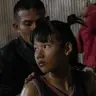 Supattra Inthirat, 12, known as Pancake, with her father before her fight at a small local fighting stage in That Phanom, Thailand.