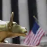 The end of the bull run? Replicas of Arturo Di Modica's iconic "Charging Bull" statue on a street vendor's table outside the New York Stock Exchange.