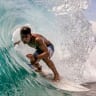 A local boy riding a barrel on Shipwreck's Beach, Nusa Lembongan Bali surfing from?Ian Neubauer