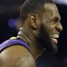 LeBron James grimaces after straining his groin.