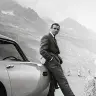 Sean Connery as James Bond, on location in Europe with his Aston Martin.