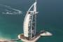 The sail-shaped Burj Al Arab hotel offers such luxuries as chauffeur-driven Rolls-Royces, helicopter flights, private ...