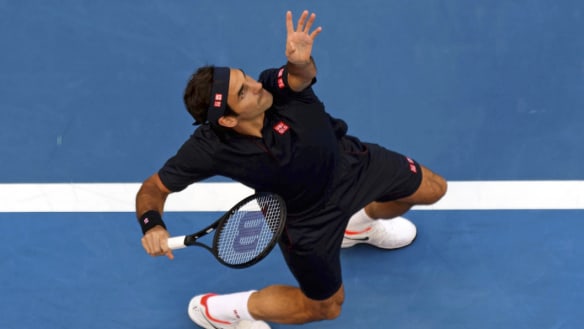 Serving it up: Switzerland's Roger Federer during his match against Stefanos Tsitsipas of Greece at the Hopman Cup in Perth.