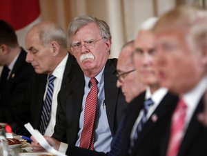 National security adviser John Bolton, second from the left, listen to President Donald Trump, far right, speak during a working lunch with Japanese Prime Minister Shinzo Abe at Trump' s private Mar-a-Lago club, Wednesday, April 18, 2018, in Palm Beach, Fla.