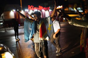 Kinshasa residents celebrate  in Kinshasa Thursday Jan. 10, 2019, after learning that opposition presidential candidate Felix Tshisekedi had been declared the winner of the elections.