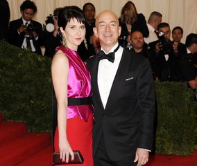 In this May 7, 2012 file photo, Amazone founder, president and CEO Jeff Bezos and wife Mackenzie Bezos arrive at the Metropolitan Museum of Art Costume Institute gala benefit, celebrating Elsa Schiaparelli and Miuccia Prada, in New York