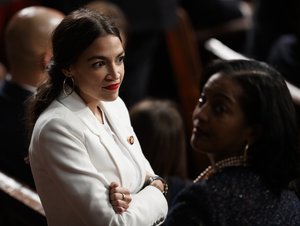 Rep. Alexandria Ocasio-Cortez, D-N.Y, and Rep. Jahana Hayes, D-Conn., stand together on the House floor at the U.S. Capitol in Washington, Thursday, Jan. 3, 2019, on the first day of the 116th Congress with Democrats holding the majority.