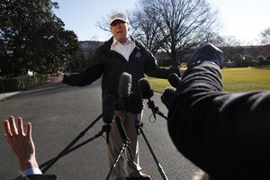 President Donald Trump gestures as reporters raise their hands while he speaks to the media on the South Lawn of the White House, Thursday Jan. 10, 2019, in Washington, en route for a trip to the border in Texas as the government shutdown continues.