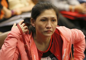 In this March 17, 2016 photo, Rizal Commercial Banking Corp. branch manager Maia Santos-Deguito takes her seat before testifying for the second time before the Philippine Senate probe into how about $81 million of Bangladesh's stolen funds were transmitted online to four private accounts at its branch in suburban Pasay city, south of Manila, Philippines.