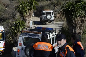 Emergency services look for a 2 year old boy who fell into a well, in a mountainous area near the town of Totalan in Malaga, Spain, Monday, Jan. 14, 2019