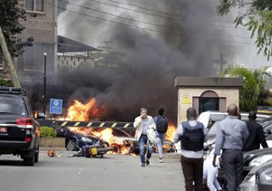 Fire and smoke rise from the scene of an explosion in Nairobi, Kenya Tuesday, Jan. 15, 2019