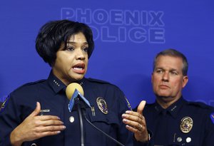 Phoenix Police Chief Jeri Williams, left, announces the arrest of Nathan Sutherland, a licensed practical nurse, on one count of sexual assault and one count of vulnerable adult abuse on an incapacitated woman who gave birth last month at a long-term health care facility Wednesday, Jan. 23, 2019, in Phoenix.