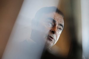 In this Friday, April 20, 2018, photo, Nissan Chairman Carlos Ghosn speaks during an interview in Hong Kong.