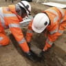 Workers remove artefacts from Capt Matthew Flinders grave in London