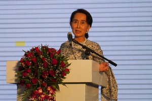 File - Nobel Peace Prize laureate Daw Aung San Suu Kyi answers questions from the participants of the East-West Center International Media Conference after announcing the launch of the Suu Foundation, a humanitarian organization dedicated to advancing the health and education of the people of Myanmar, 9 March, 2014.