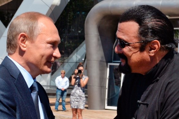 Russian President Vladimir Putin, left, and U.S. actor Steven Seagal shake hands after visiting an oceanarium built on Russky Island, where the Eastern Economic Forum takes place, in Russian Far Eastern port of Vladivostok, Russia, Friday, Sept. 4, 2015. (AP Photo/RIA Novosti, Alexei Druzhinin, Presidential Press Service)