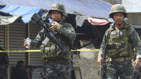 Soldiers at the scene after two bombs exploded outside a Roman Catholic cathedral in Jolo, the capital of Sulu province in southern Philippines on January 27.