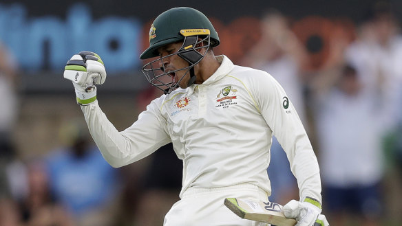 Usman Khawaja celebrates making 100 runs.