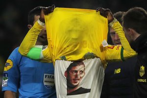 Nantes' Waris Majeed shows his jersey printed with the image of Argentinian player Emiliano Sala after scoring his side opening goal during the French League One soccer match Nantes against Saint-Etienne at La Beaujoire stadium in Nantes, western France, Wednesday, Jan.30, 2019.