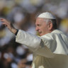 Pope Francis blesses worshippers during a Mass at the Sheikh Zayed Sports City in Abu Dhabi.