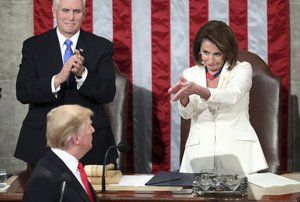 President Donald Trump turns to House speaker Nancy Pelosi of Calif., as he delivers his State of the Union address to a joint session of Congress on Capitol Hill in Washington, as Vice President Mike Pence  watches, Tuesday, Feb. 5, 2019.