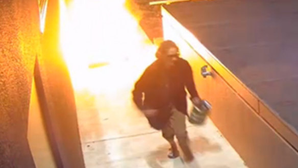 Woman caught on camera setting fires outside businesses