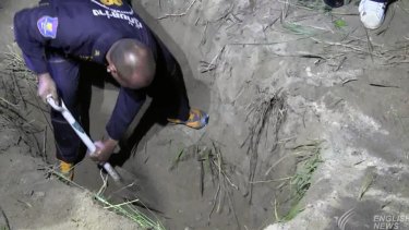 Wayne Schneider's body was found in a two-metre-deep grave in roadside bushes near a Chinese temple.