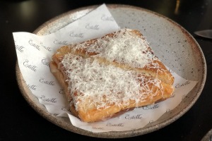 At Estelle's bar, wagyu bolognese and kimchi toasties come buried in grated parmesan.